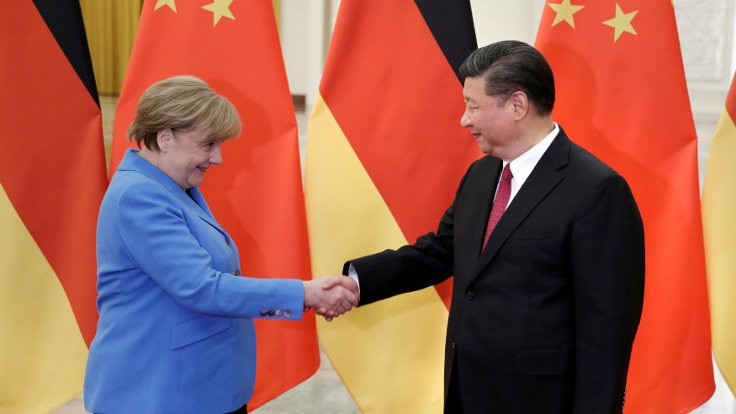 Merkel'den çağrı: Ticaret savaşını çözün